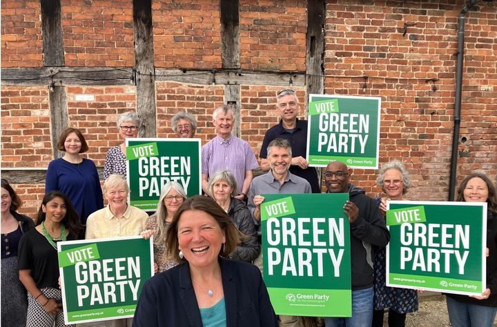 Ellie Chowns with a team of volunteers holding placards with 'Vote Green Party'