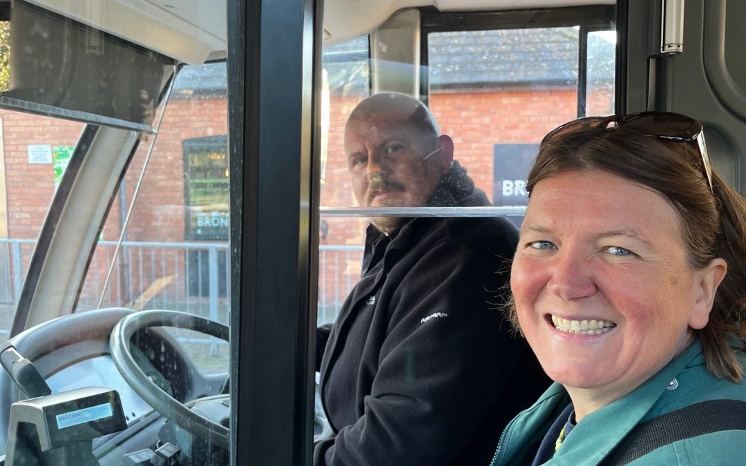 Ellie Chowns buying her bus ticket on the 465 bus.