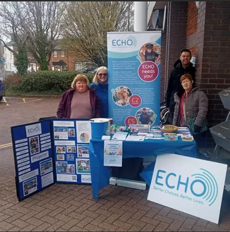 people are standing with big boards of echo