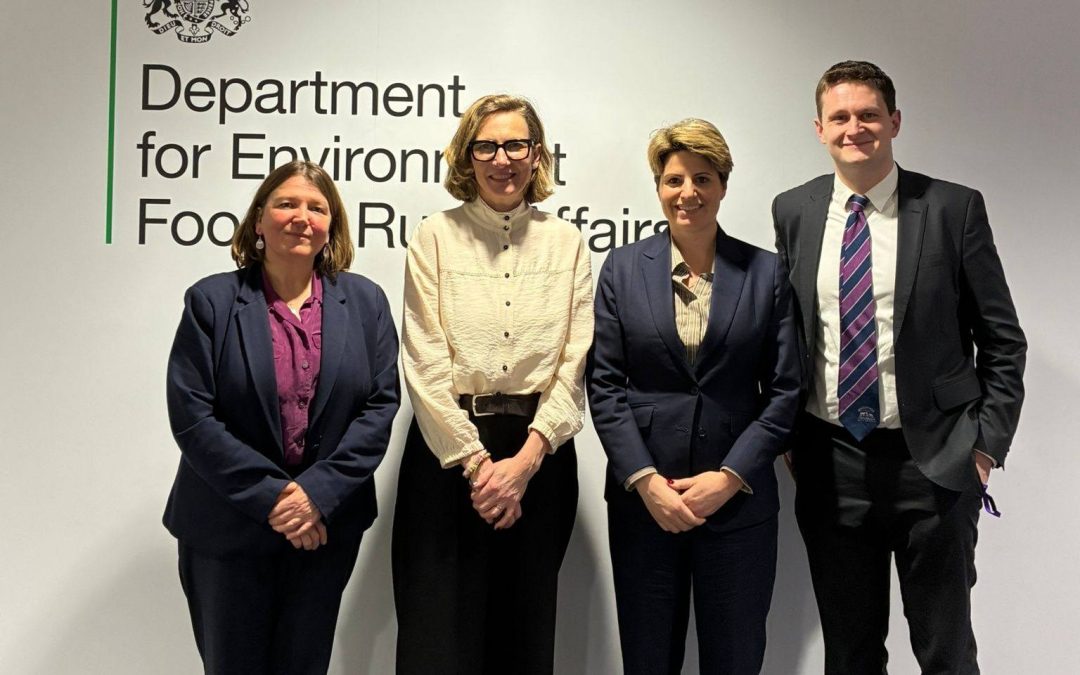 Ellie is standing with 3 ministers from Environment department. 2 of them are female and 1 male